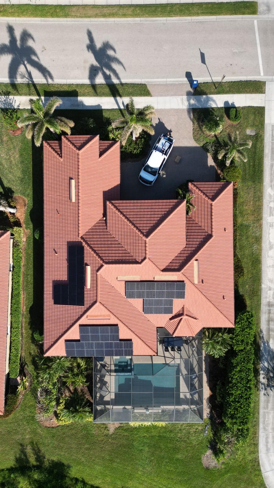 Aerial view of solar installation on tile roof home in Southwest FL