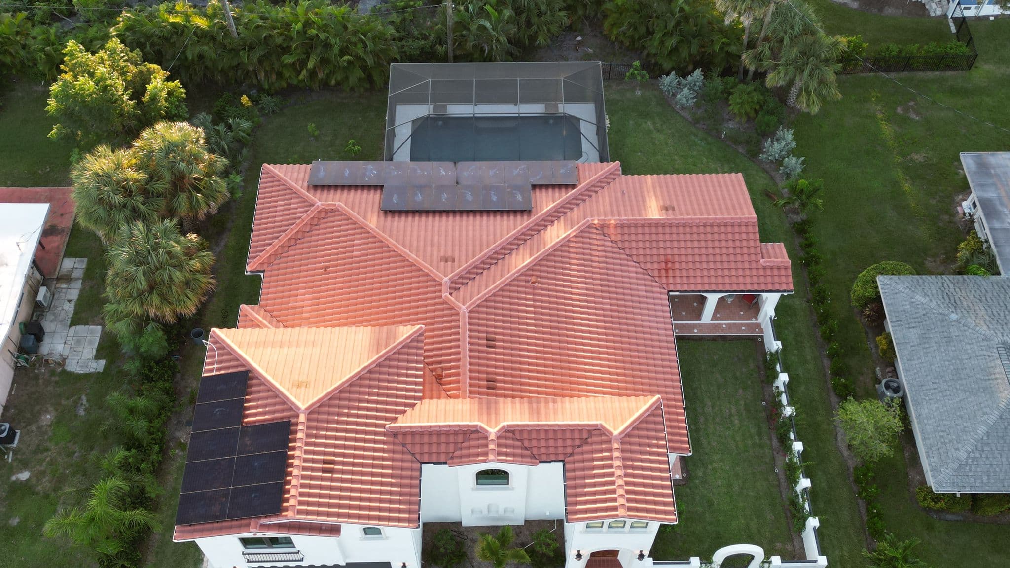 Aerial view of solar panel installation on Mediterranean-style home in Venice, FL