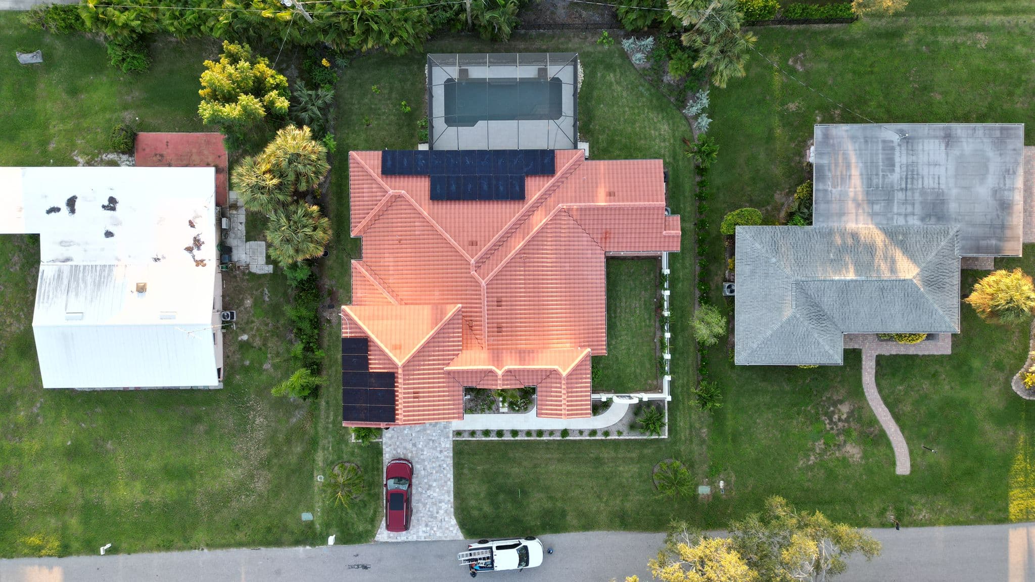 Top-down drone view of solar system on tile roof in Venice, FL