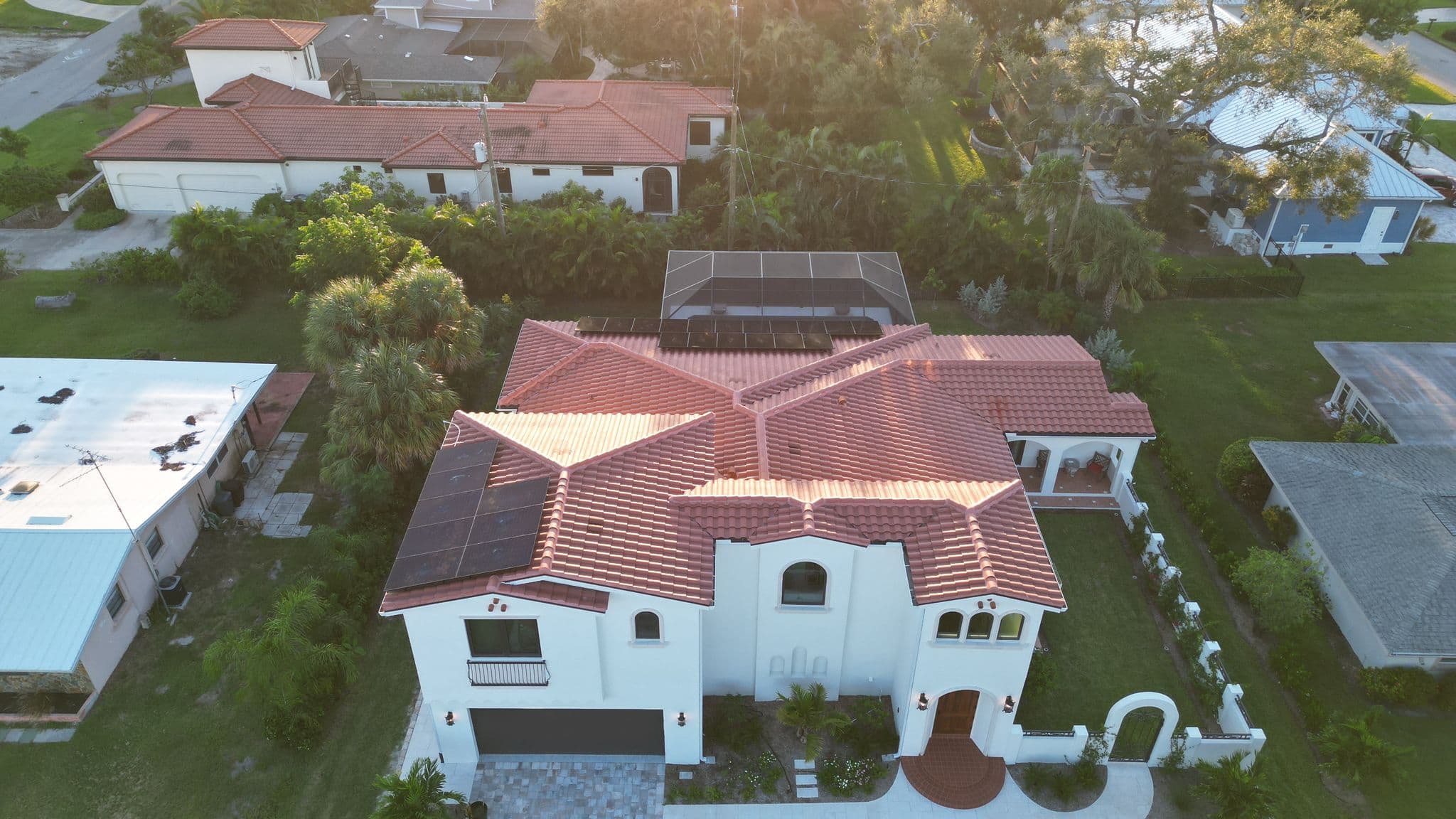 Angled aerial view of solar installation on Spanish-style home in Venice, FL