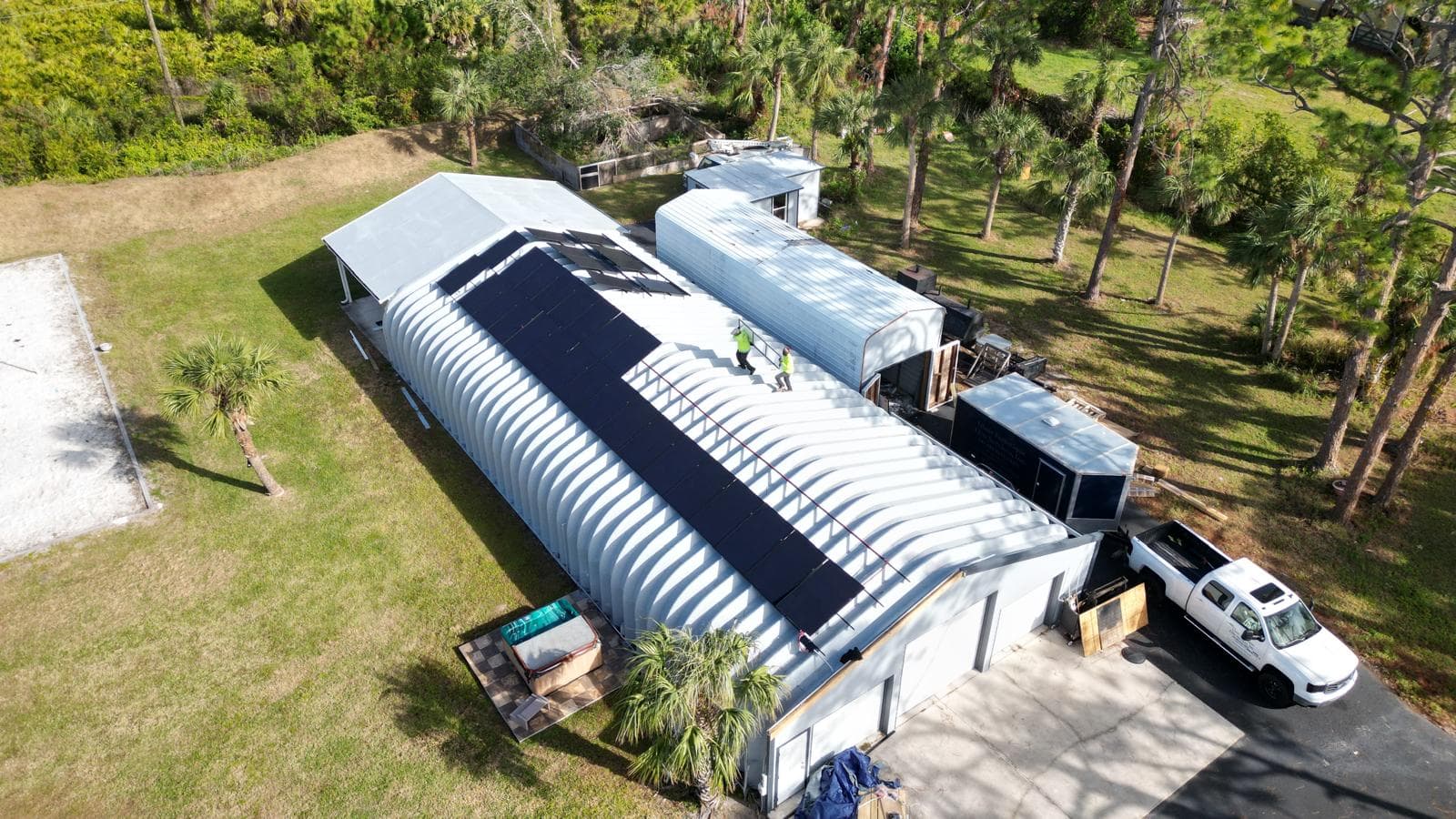 S7 Solar crew installing solar panels on commercial metal building in Southwest FL